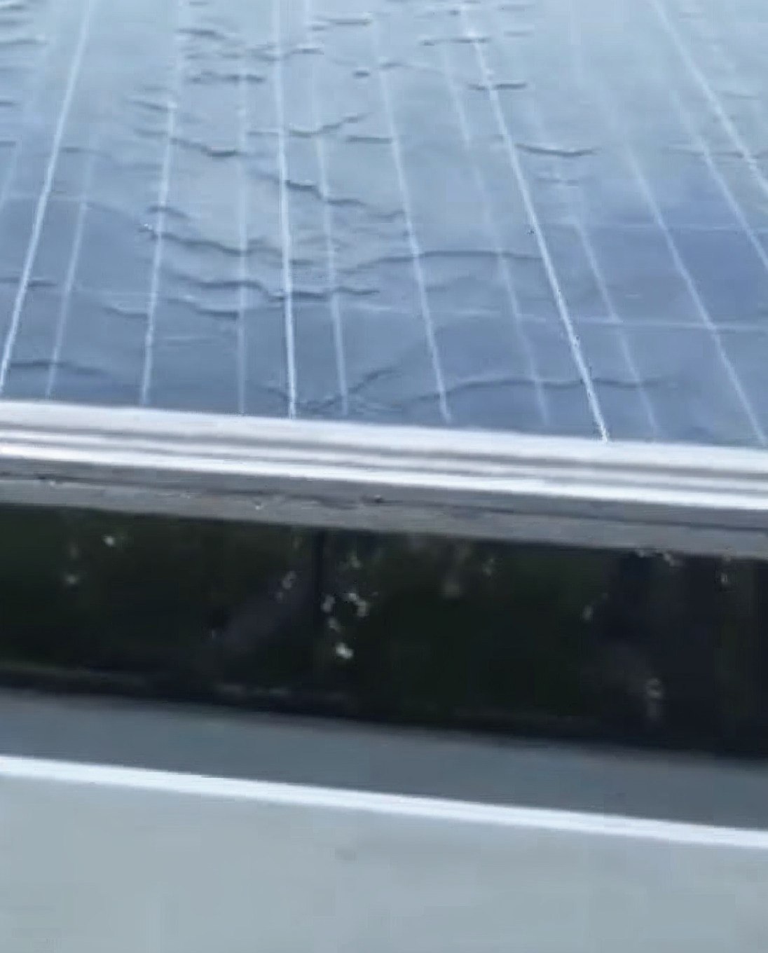 Freshly washed panel draining into the collection gutter